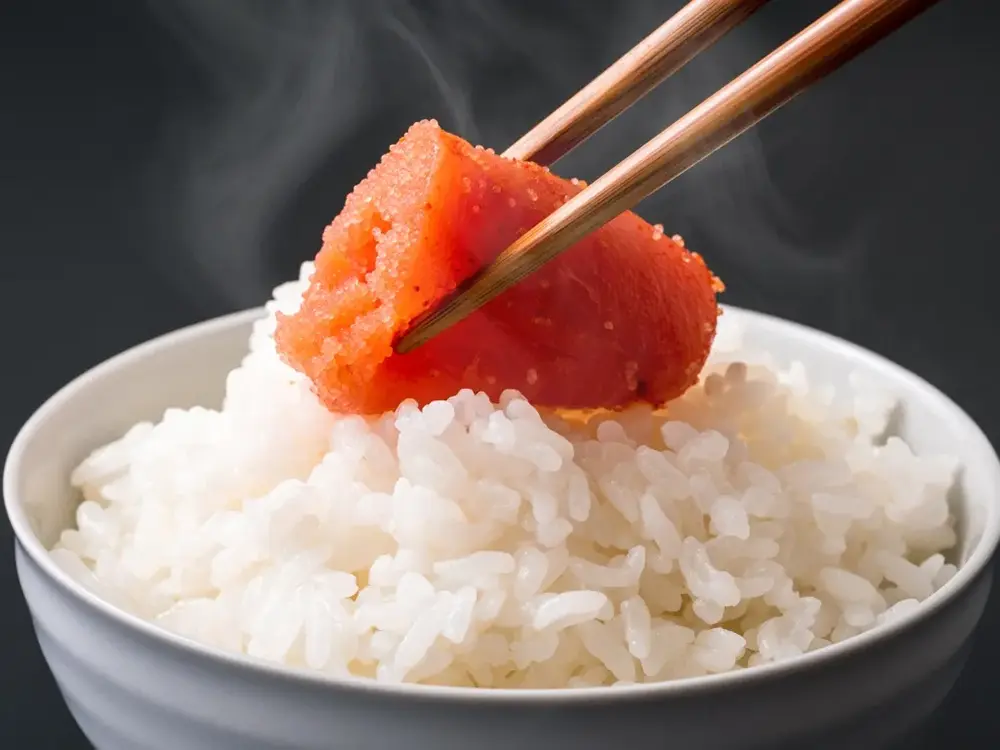 ご飯の上にのった明太子の画像